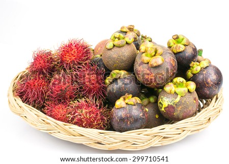 Fresh and ripe rambutan and mangosteen in bamboo basket for tropical fruits background