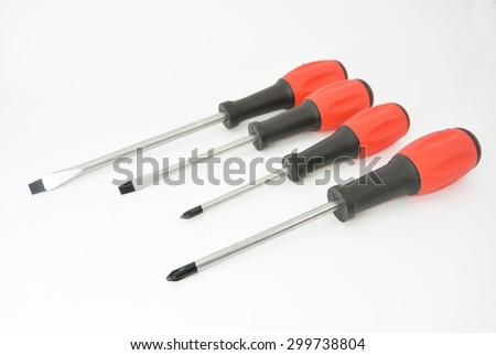 some screwdrivers with red black handle and white texture