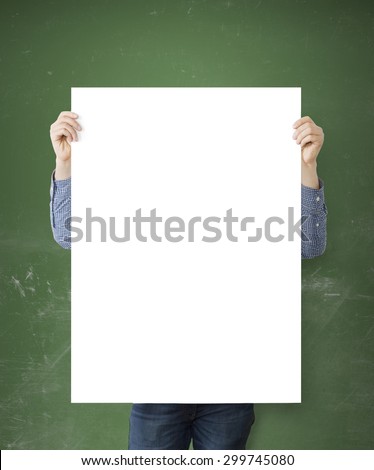 hipster holding blank poster on concrete floor