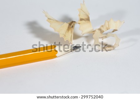 An image for back to school theme. A single pencil just sharpened with trashes with it. Image has a lot of space for text.
