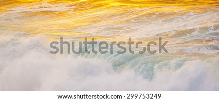 beautiful waves at the beach in sunset