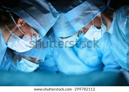 Young surgery team in the operating room Royalty-Free Stock Photo #299782112