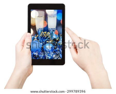 take photo of blue Christmas still life with tablet pc isolated on white background