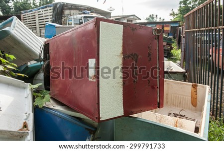 Old refrigerator that is broken or breaking the pile at the plant waste for recycling.  Royalty-Free Stock Photo #299791733