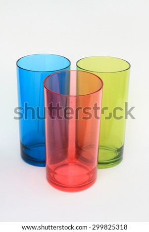 Plastic cups of various color isolated on white background