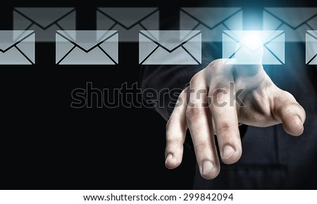 Businessman hand pressing icon of media screen