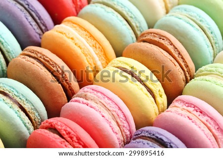 French colorful macarons background, close up Royalty-Free Stock Photo #299895416