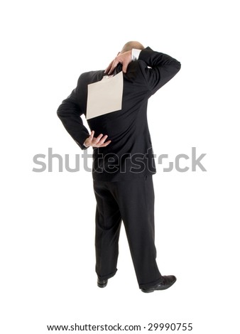 Stock photo of the back side of a well dressed businessman facing away from the camera with a blank sheet of paper taped to his back.