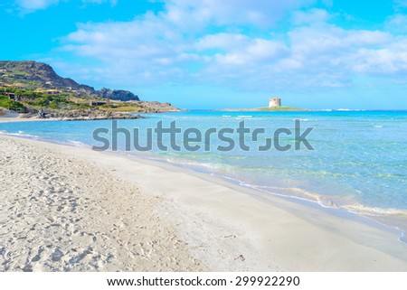 La Pelosa beach under a cloudy sky, Sardinia Royalty-Free Stock Photo #299922290