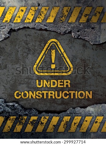 Under construction sign on concrete cement wall background
