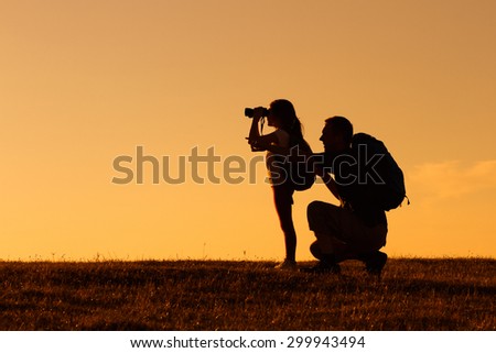 Silhouette of father and daughter hiking together.Father and daughter hiking Royalty-Free Stock Photo #299943494