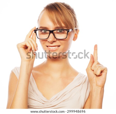 woman wearing glasses pointing up isolated on white 