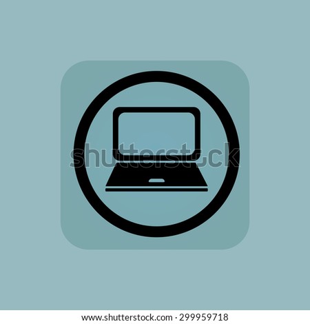 Laptop in circle, in square, on pale blue background