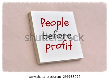 Text people before profit on the short note texture background