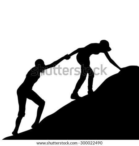 Silhouettes of girl giving helping hand to her friend to climb up the last section of mountain