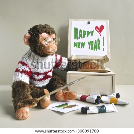 2016 - the year of the monkey. Toy monkey - painter