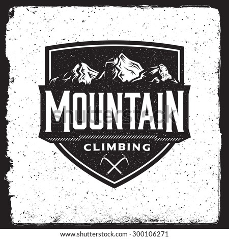 mountain climbing vintage emblem. logotype template with mountains, ice axe. outdoor activity symbol  with ink stamp texture