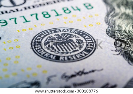 Federal reserve system symbol on hundred dollar bill closeup macro shot Royalty-Free Stock Photo #300108776