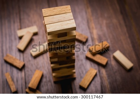 Wood block tower game for children. Royalty-Free Stock Photo #300117467
