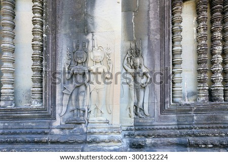 close-up texture of stone carving ancient bas-reliefs of the Temple of Angkor Wat in Cambodia