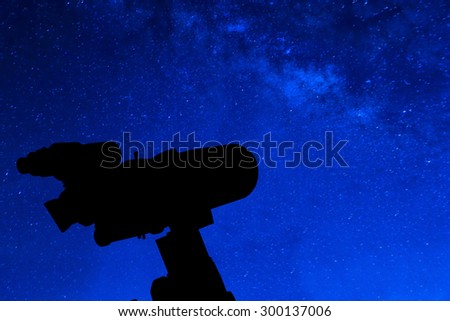 Silhouette of Telescope and beautiful star background.