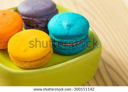 Colorful French Macaroons On Wooden background