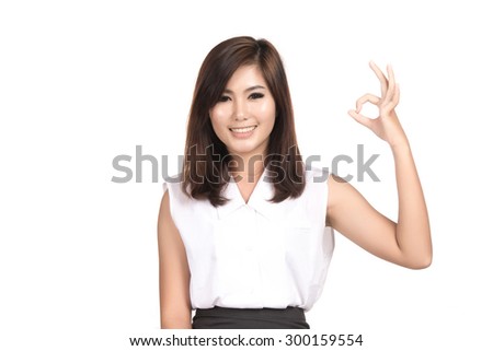 Asian woman showing OK sign with blank copyspace area for text or slogan,Closeup portrait of beautiful Asian woman,Thai girl,Positive human emotion facial expression,isolated on white background