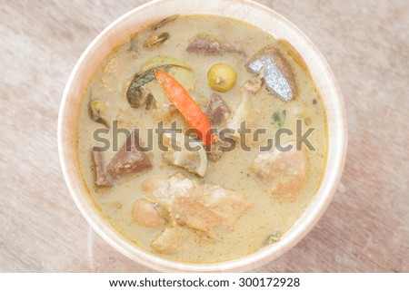 Grren curry in wooden bowl, stock photo