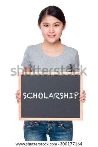 Woman hold with chalkboard and showing a word scholarship