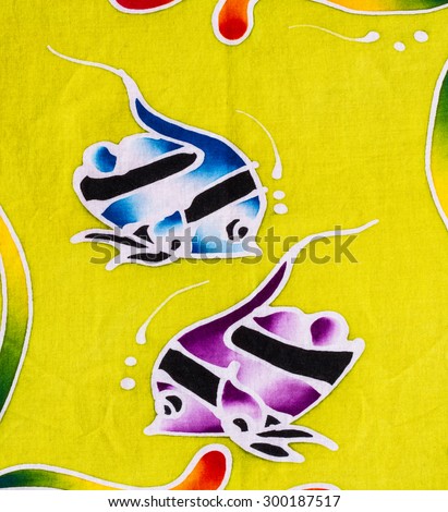 Colorful fishes fabric close up background.