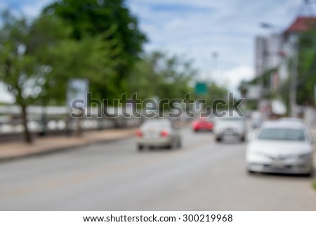 blur image of car on road in daytime