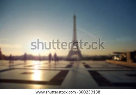 Blurred background defocus of silhouette Eiffel tower in Paris. Trocadero shallow depth of focus