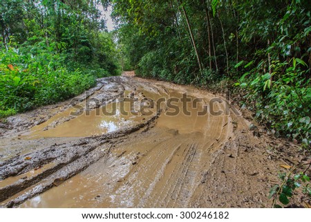 4x4,Muddy road with adventure to the forest in rainy season,Road - a tough trip in the countryside of Thailand.