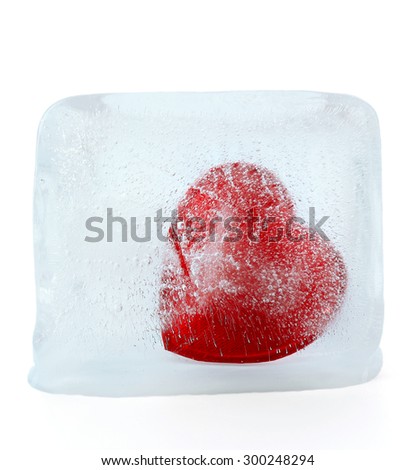 Red heart in ice cube isolated on white