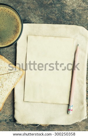 empty paper note  with coffee and bread wheat.Vintage Style.