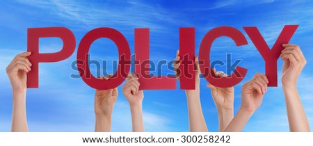 Many Caucasian People And Hands Holding Red Straight Letters Or Characters Building The English Word Policy On Blue Sky