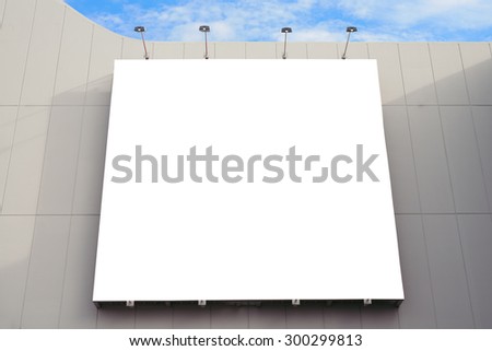 Blank poster billboard wall with copy space for your text message or content in modern shopping mall on a cloudy day.