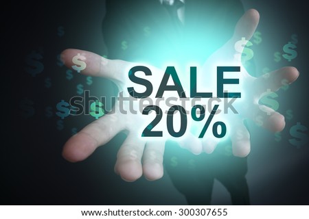 Glowing text "Sale 20%" in the hands of a businessman. Business concept. 