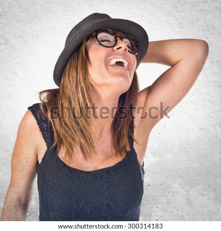 Woman smiling over grey background