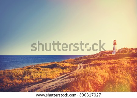 View on old lighthouse near a sea in autumn time