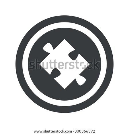 Image of puzzle piece in circle, on black circle, isolated on white