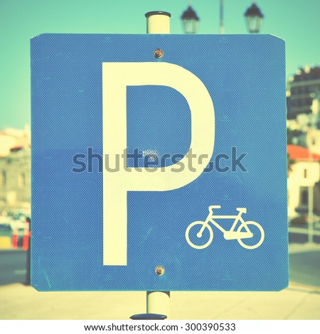 Bicycle parking lot sign close-up. Instagram style filtered image