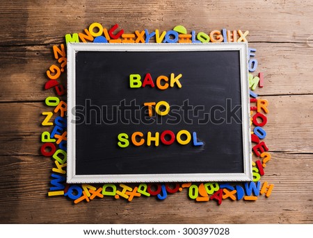 Back to school sign formed from colorful plastic letters. 