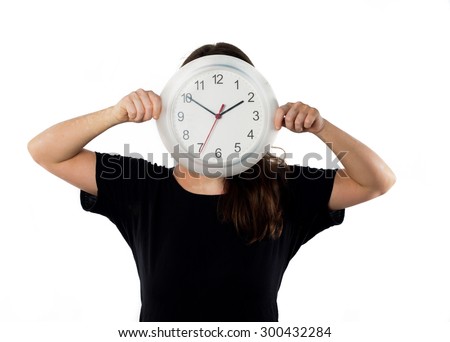 Young girl with clock in front of his face, isolated on white background