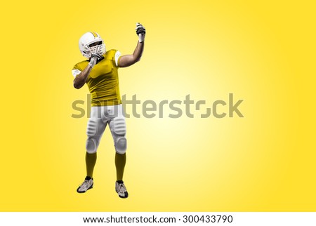 Football Player with a yellow uniform making a selfie on a yellow background.