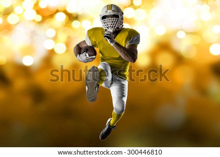 Football Player with a yellow uniform Running on a yellow lights background.