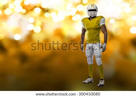 Football Player with a yellow uniform on a yellow lights background.