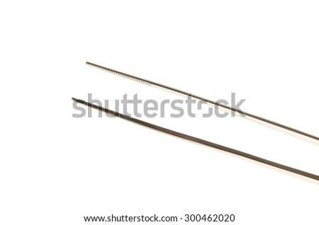metal tweezers for laboratories over the white background