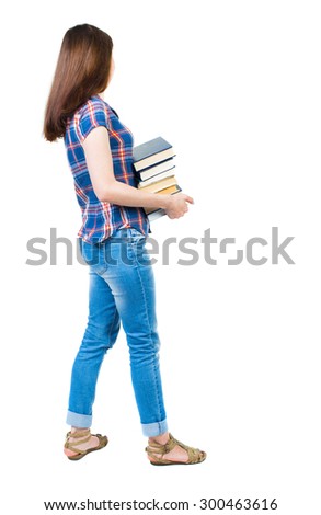 girl carries a heavy pile of books. side view. Rear view people collection. backside view person. young girl in checkered blue with red stripes stands sideways and holding a stack college textbooks.