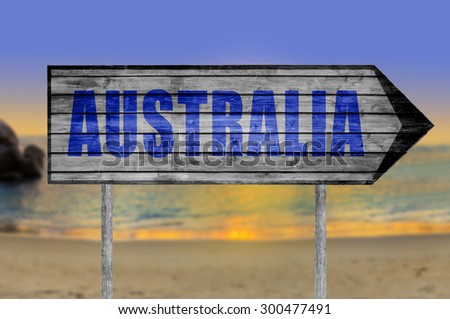Australia wooden sign with beach background